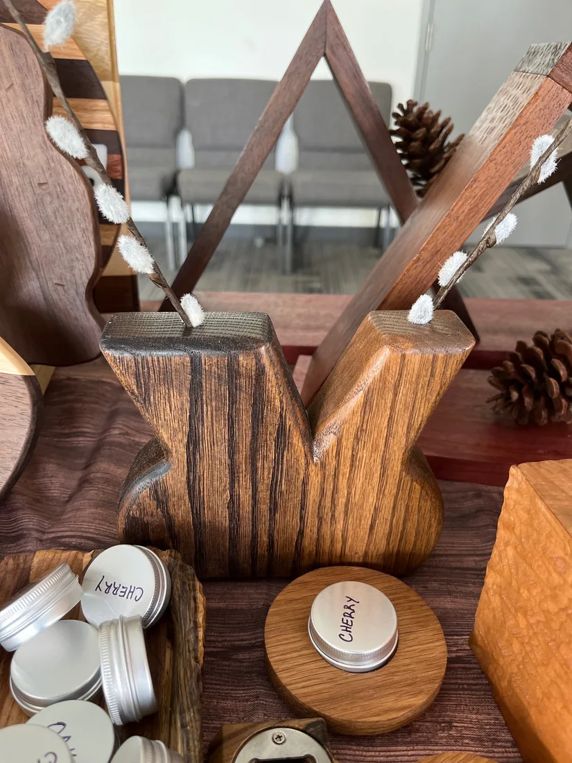 Wooden centerpiece with layered form and polished finish