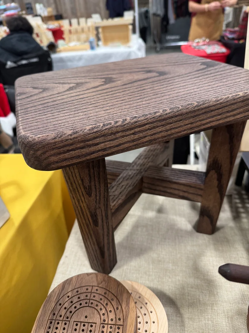 Close-up of a low oak bench with visible grain and clean joinery