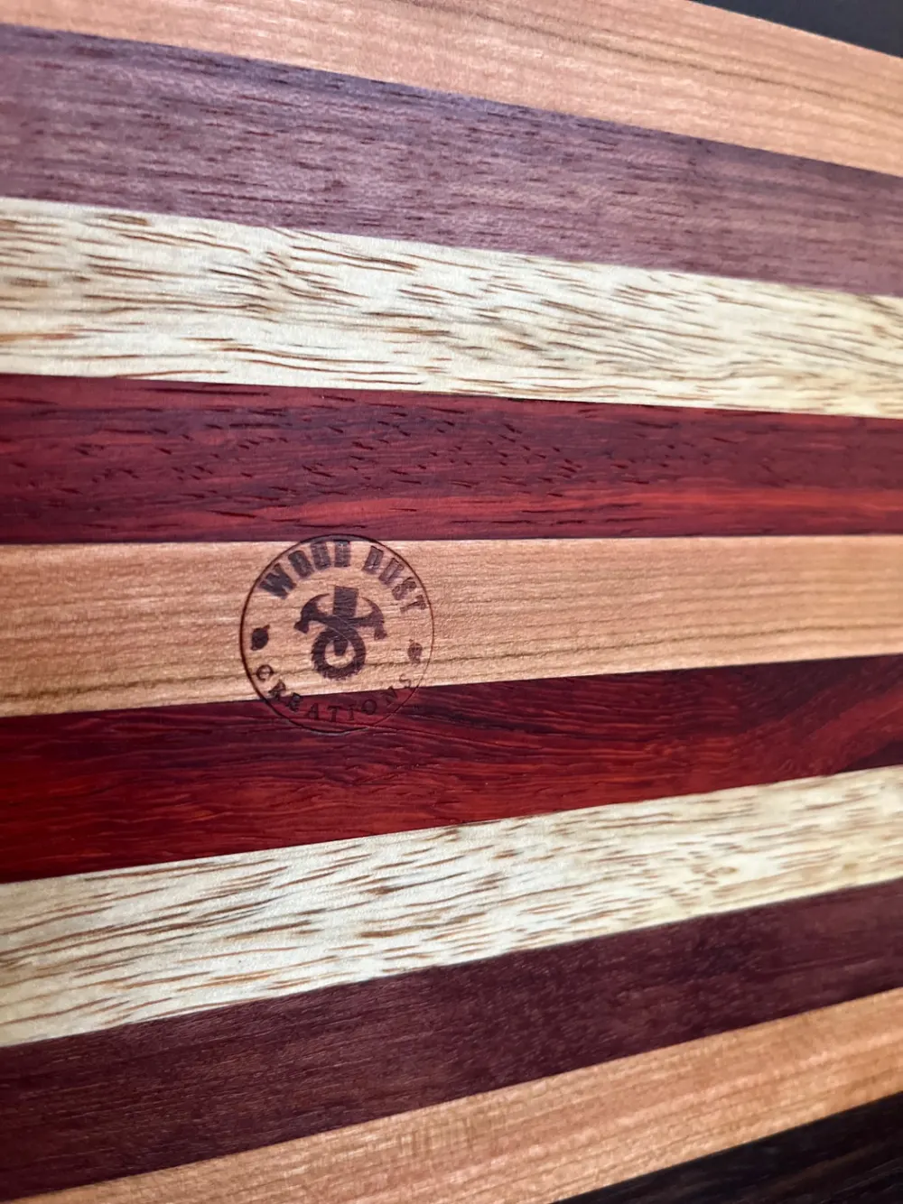 Edge grain cutting board made with mixed hardwood strips